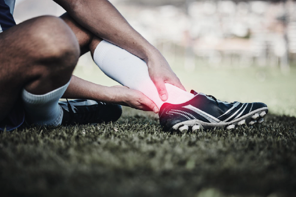 Photo injury soccer and a man on a field with foot pain training accident and medical emergency