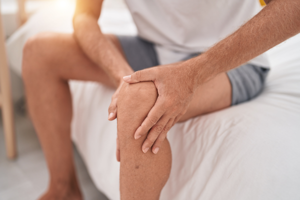 Someone holding their knee